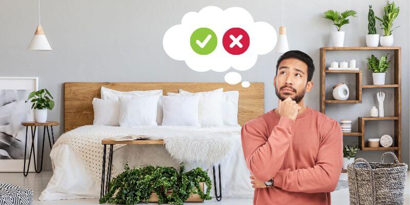 man thinking about the right ways to clean his bed
