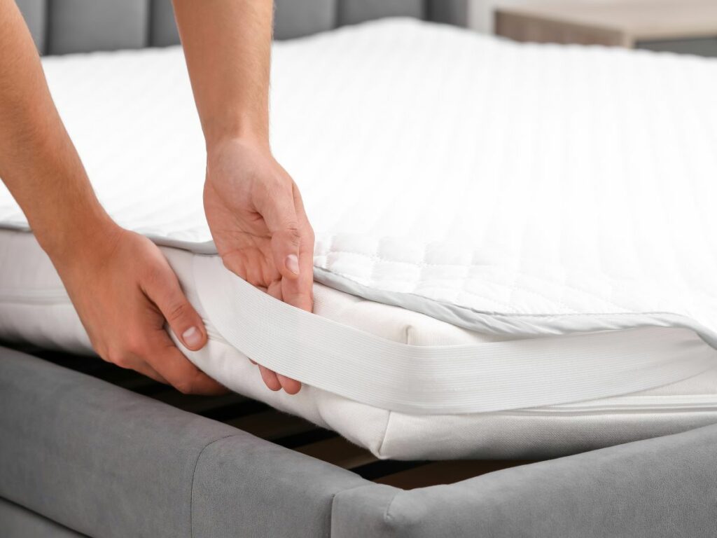 strapping on a mattress protector