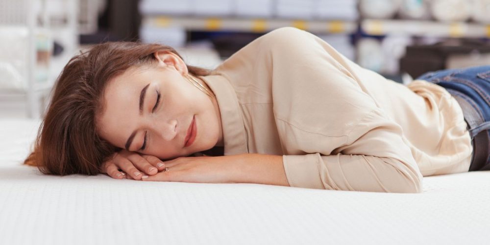 girl sleeping well on a bed